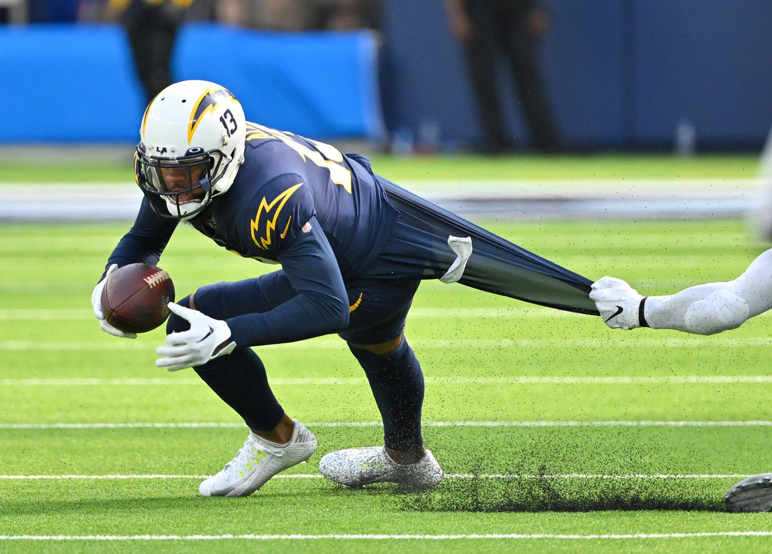 Oct 23, 2022; Inglewood, California, USA; Los Angeles Chargers wide receiver Keenan Allen (13) runs for a first down before he is stopped by Seattle Seahawks linebacker Jordyn Brooks (56) in the first half at SoFi Stadium. Mandatory Credit: Jayne Kamin-Oncea-USA TODAY Sports